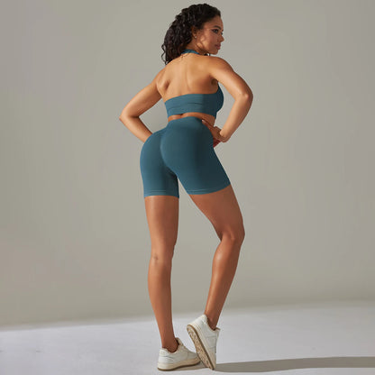 Nahtloses Damen-Yoga-Set: ärmelloses Top und Biker-Shorts in Petrolblau
