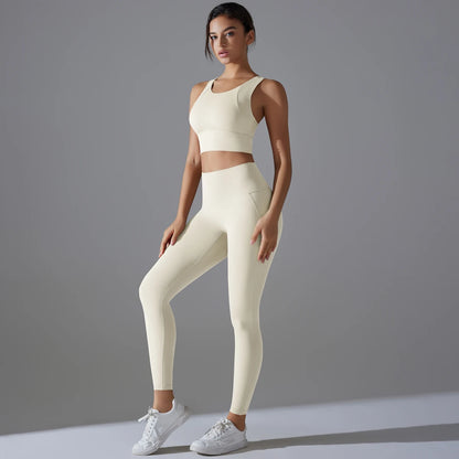 Damen-Yoga-Set in Hellivory: ärmelloses Crop-Top und lange Laufhose, eng anliegend