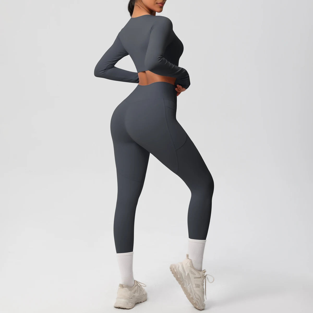 Dunkelblaues Yoga-Set in Seitenansicht, Leggings mit weißem Knieschutz