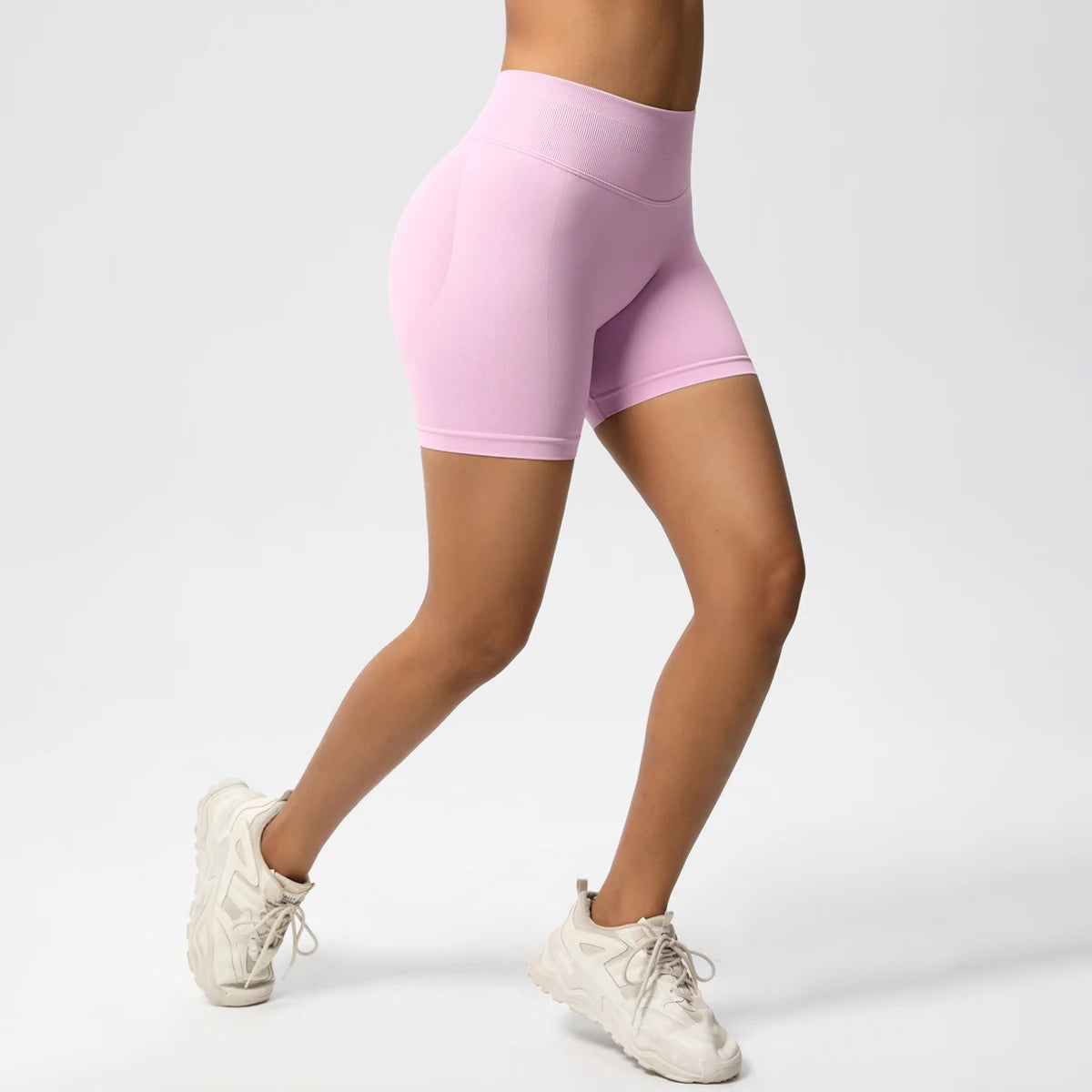 Damen-Yoga-Shorts High-Waist, rosa, Seitenansicht mit kompaktem Beinabschluss