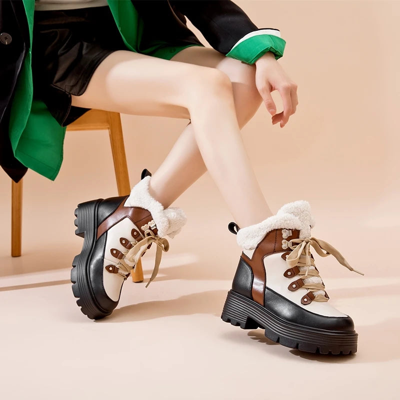 Damen-Snowboots aus Lederoptik, braun-schwarz, Schnürung und Plüschfutter, Profilsohle
