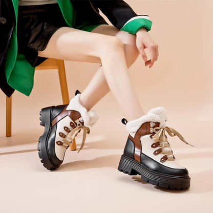 Damen-Snowboots aus Lederoptik, braun-schwarz, Schnürung und Plüschfutter, Profilsohle