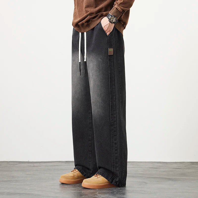 Männer Jeans mit elastischer Taille in schwarz-blauer Farbgebung im Hip Hop Stil