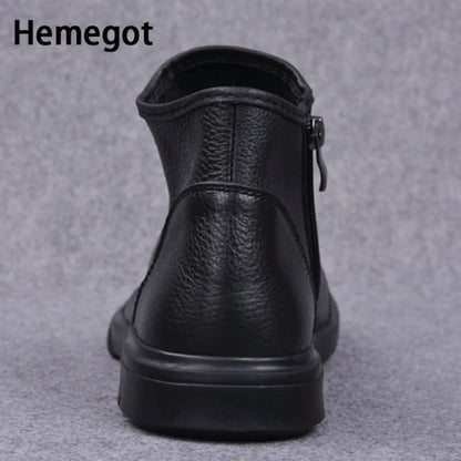 Schwarze Chelsea-Boots mit flachem Absatz, hinten geschlossenem Schaft und seitlichem Reißverschluss