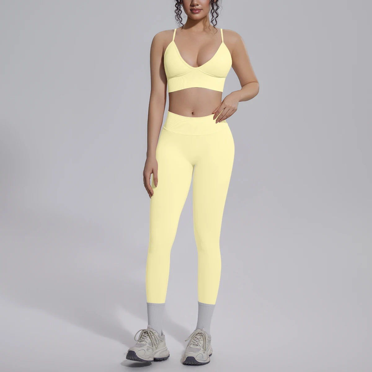 Yoga-Set für Damen mit gepolstertem Sport-BH und Leggings, hellgelb, vorne