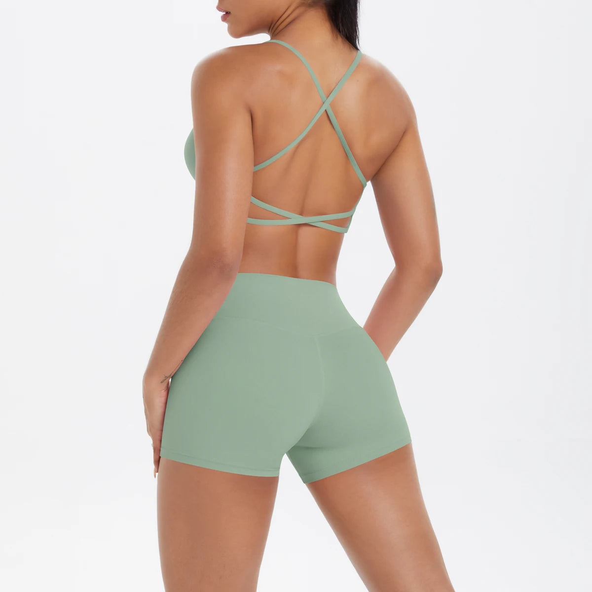 Damen-Yoga-Set: Crop-Top mit gekreuzten Rückenträgern und Shorts, grün/türkis
