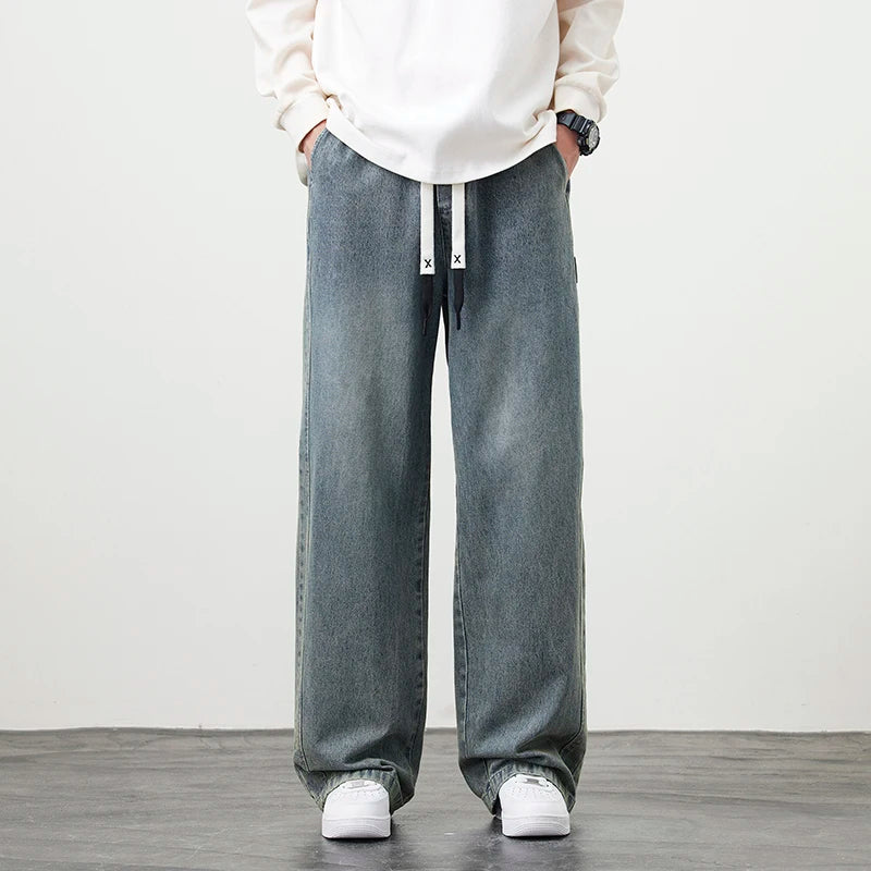 Männer Jeans mit elastischer Taille in schwarz-blauer Farbgebung im Hip Hop Stil