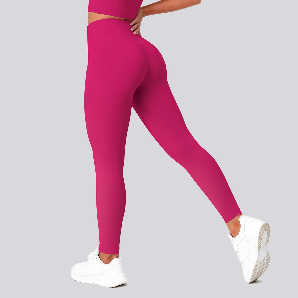 Pinkfarbene Yoga-Leggings mit hohem Bund, seitliche Ansicht, schmaler Beinverlauf