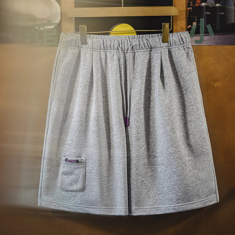 Herren Jogger-Shorts aus atmungsaktivem Material mit elastischer Taille und lockerer Passform