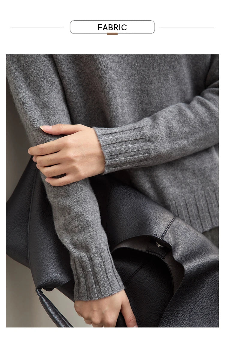 Grau melierter Pullover: gerippte Ärmelbündchen und Hand am Stoffdetail