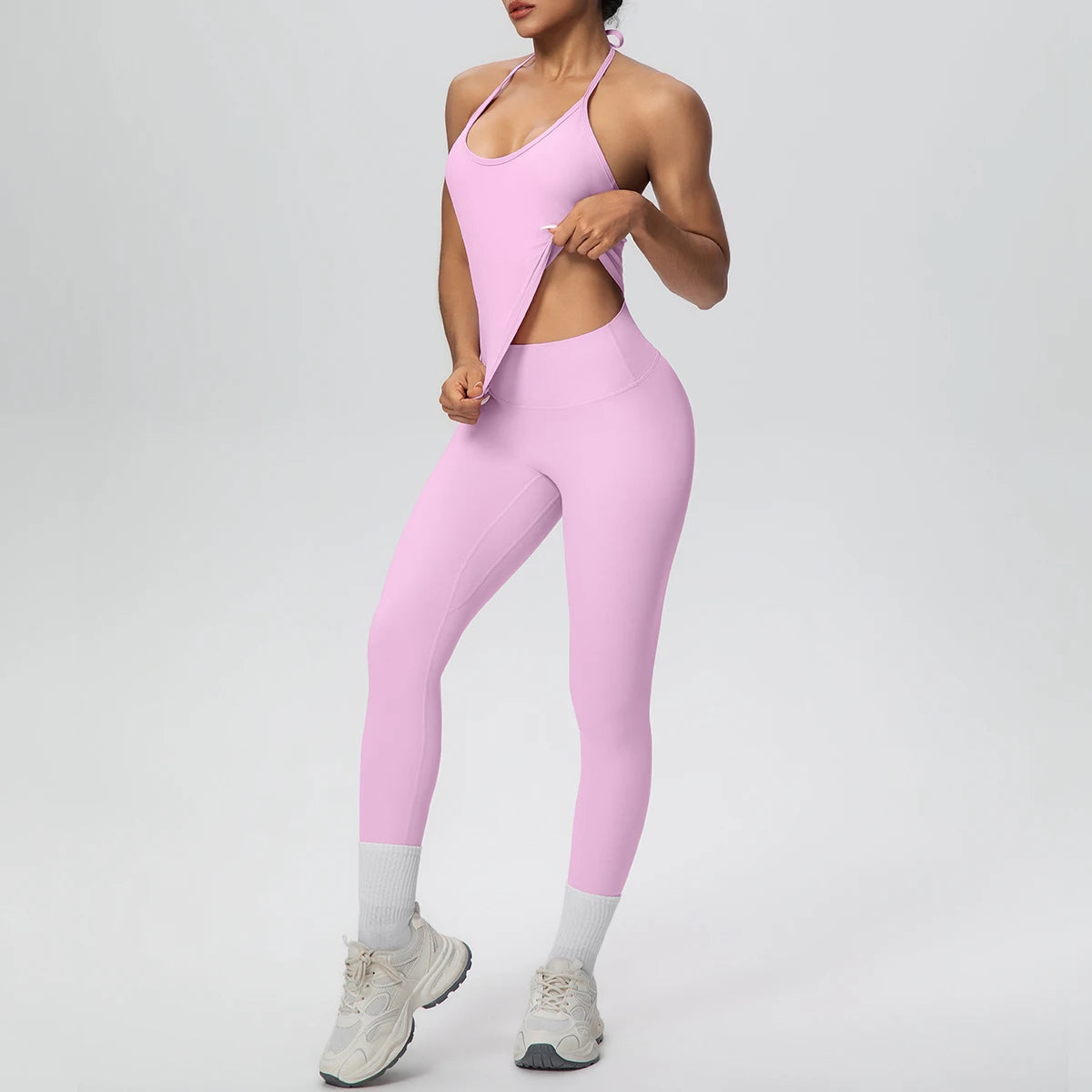 Rosa Damen-Yogaset: ärmelloses Tanktop und Capri-Leggings mit hellen Knöchel-Bündchen