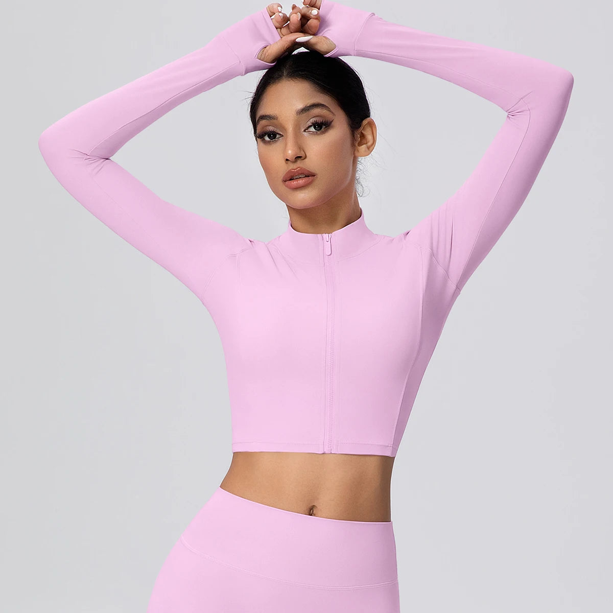 Hellrosa Damen-Zipper-Top mit Stehkragen, durchgehendem Reißverschluss, Daumenlöcher sichtbar