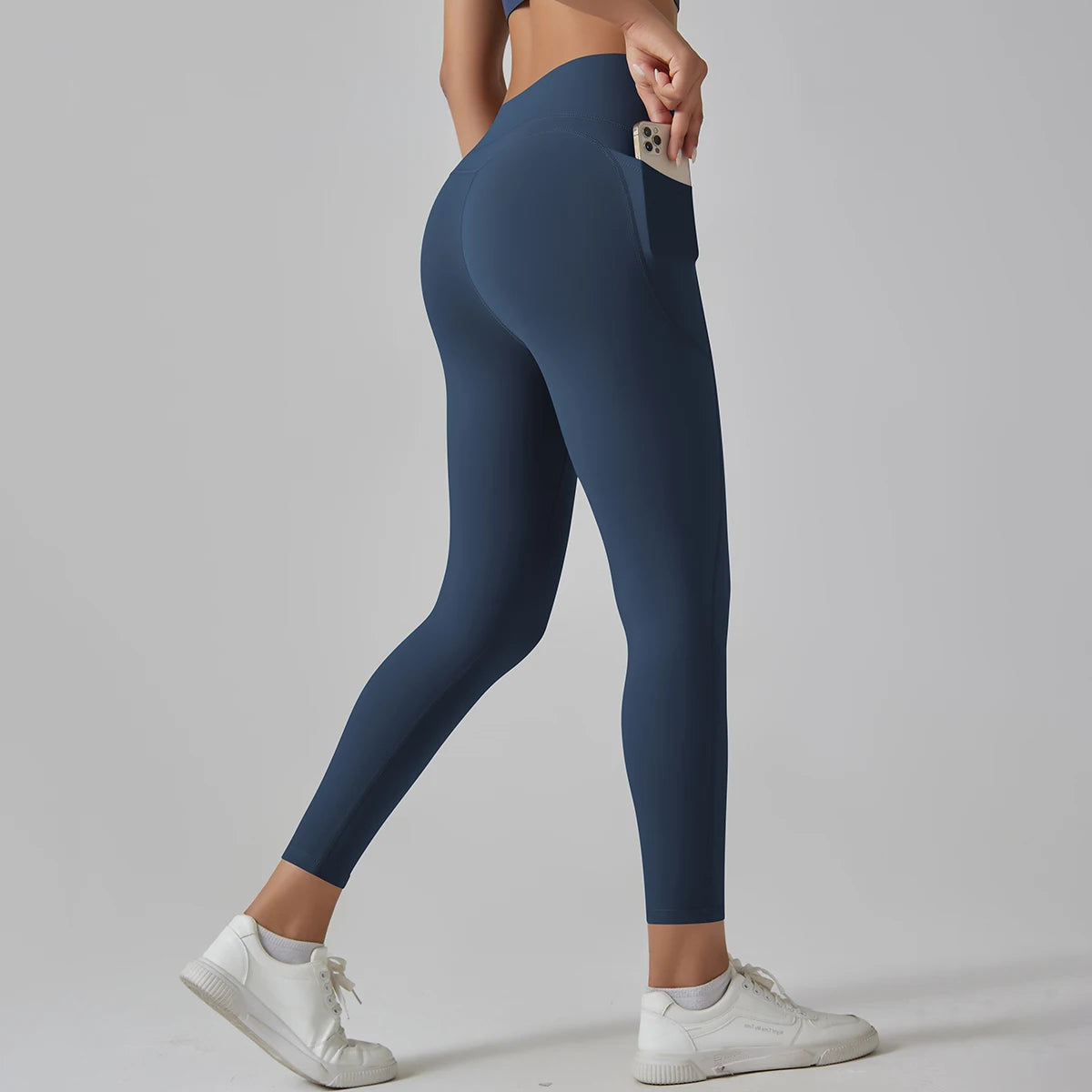 Dunkelblaue High-Waist-Leggings mit Taschen, seitliche Ganzansicht