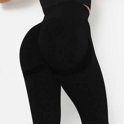 Nahtlose Yoga-Leggings, hochtailliert, schwarz mit Bauchkontrolle und atmungsaktiver Textur.