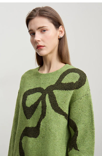 Grüner Damenpullover mit Schleifen-Jacquard, Rundhalsausschnitt, Nahaufnahme