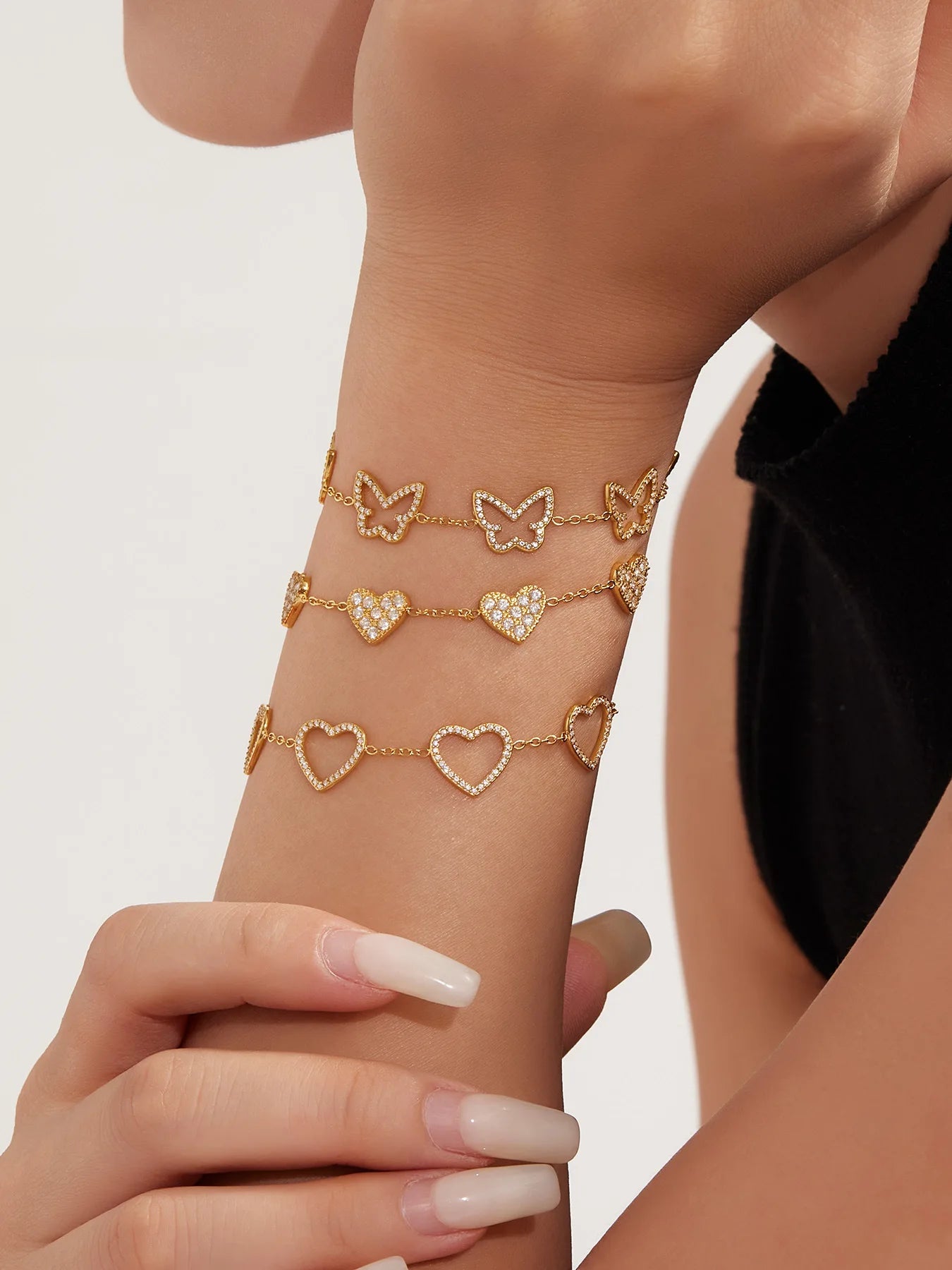 Damen-Charm-Armband mit Herzschleife und Zirkonia