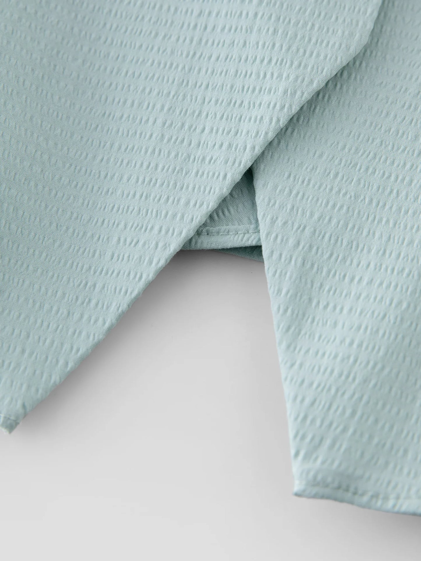 Elastisches Damen-Strickshirt in Übergröße mit kurzen Ärmeln – stilvoll und ideal für den Sommer.