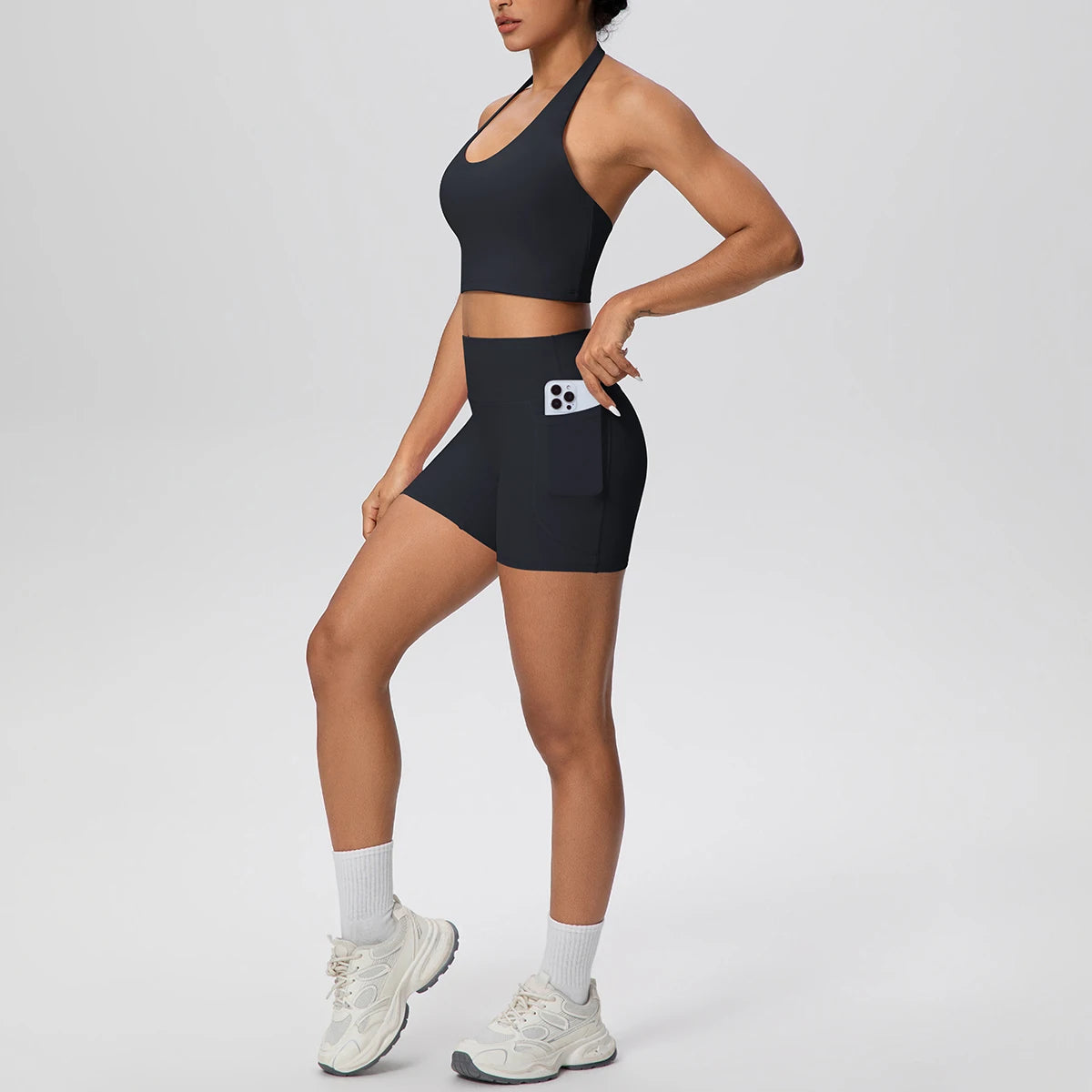 Damen-Yoga-Set mit schwarzem BH-Top und Shorts, mit Fronttasche
