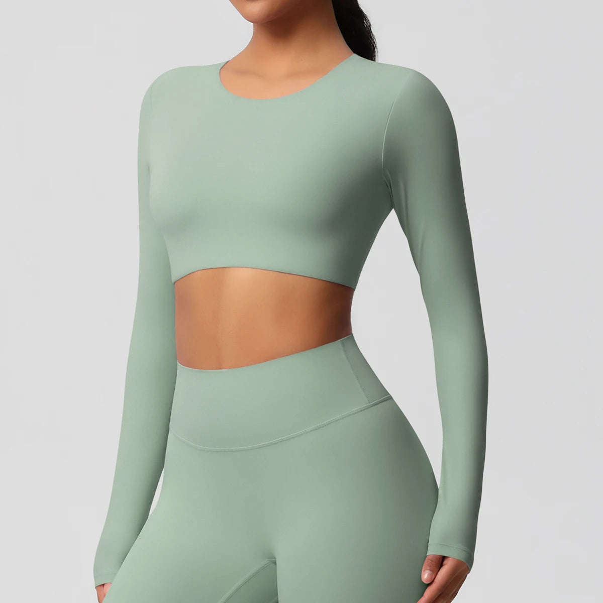 Damen Sportshirt mit Rundhalsausschnitt, langarm, kurz geschnitten, hellgrün