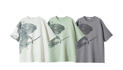Damen T-Shirt mit lockerem O-Ausschnitt und Blumenmuster sowie Stickerei