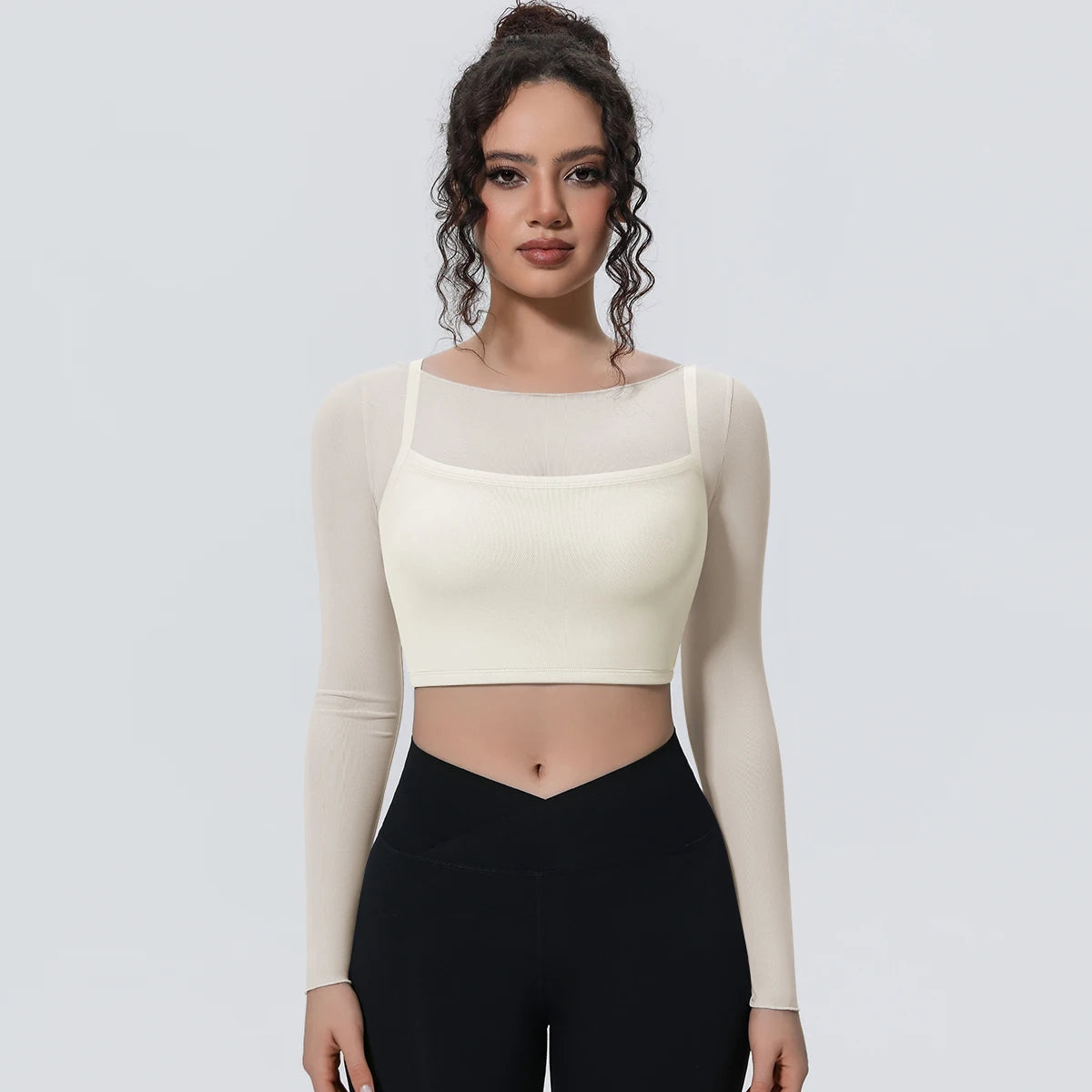 Damen Langarm-Yoga-Shirt hellivory, vordere Ansicht: Crop-Top mit Netz-Einsätzen und langen Ärmeln