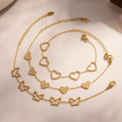 Damen-Charm-Armband mit Herzschleife und Zirkonia