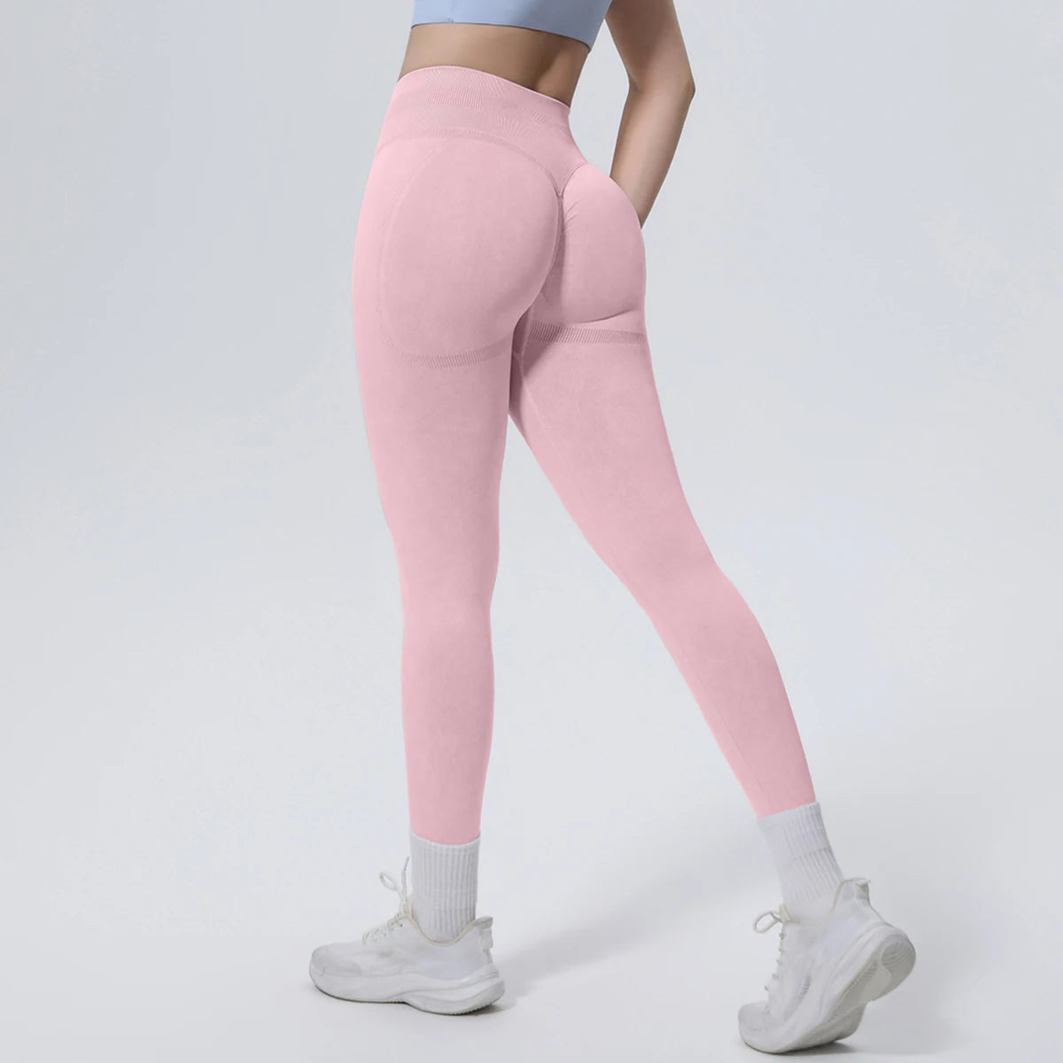 Nahtlose Yoga-Hose in Rosa, seitlich-hintere Ansicht mit figurformendem Schnitt
