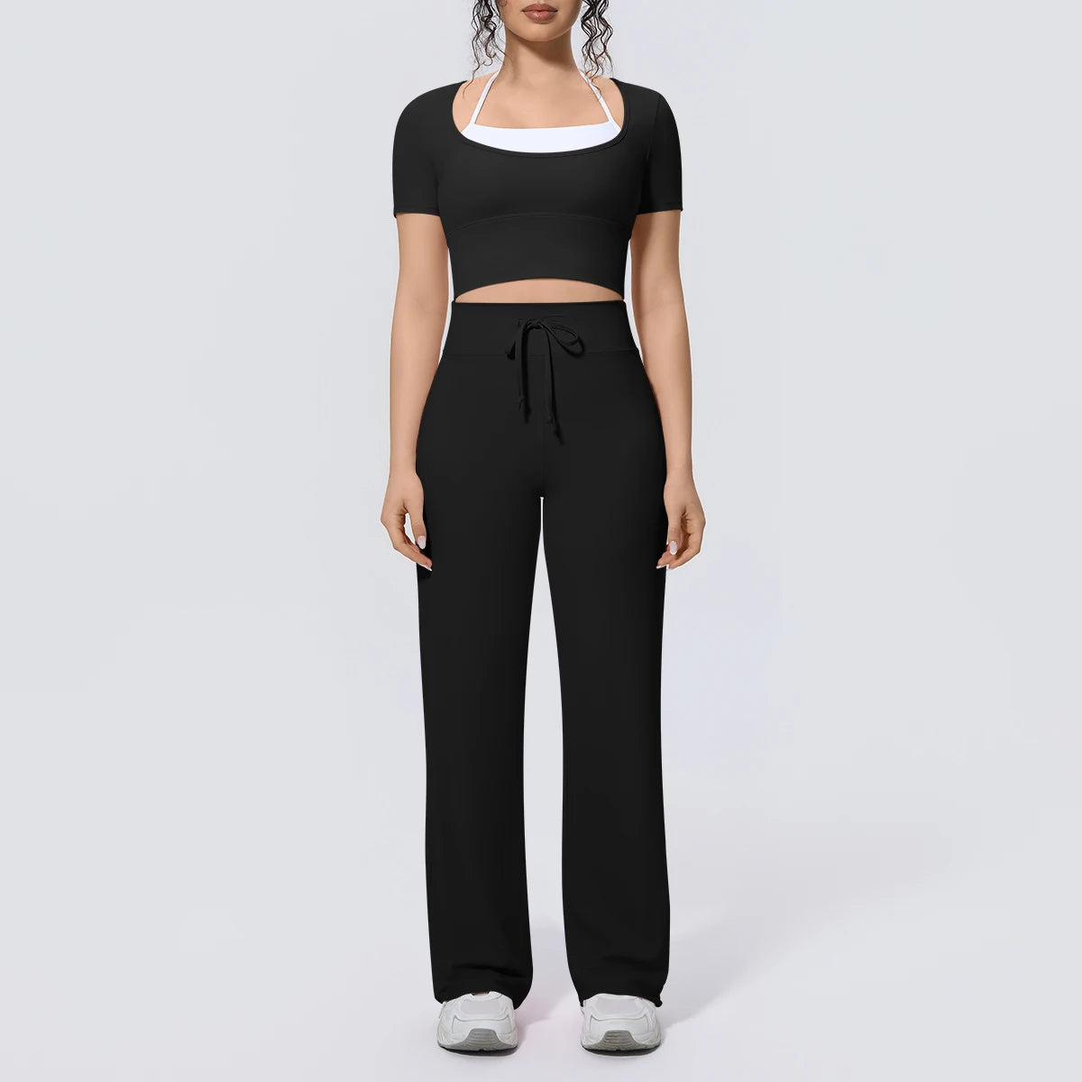 Schwarzes Yoga-Set mit kurzem Crop-Top und weiter Hose, Kordelzug am Bund