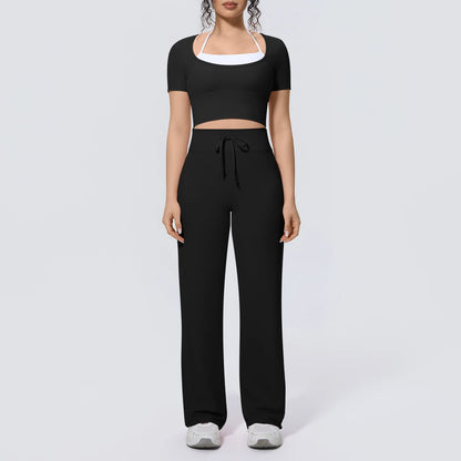 Schwarzes Yoga-Set mit kurzem Crop-Top und weiter Hose, Kordelzug am Bund