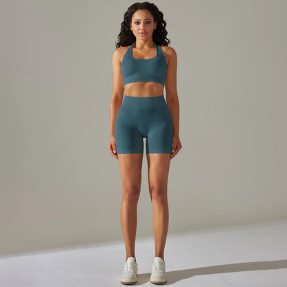 Nahtloses Damen-Yoga-Set: ärmelloses Top und Biker-Shorts in Petrolblau