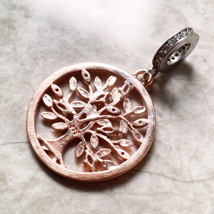 Schmuckanhänger Baum des Lebens, roségoldfarben, runde Öffnung mit lila Steinchen