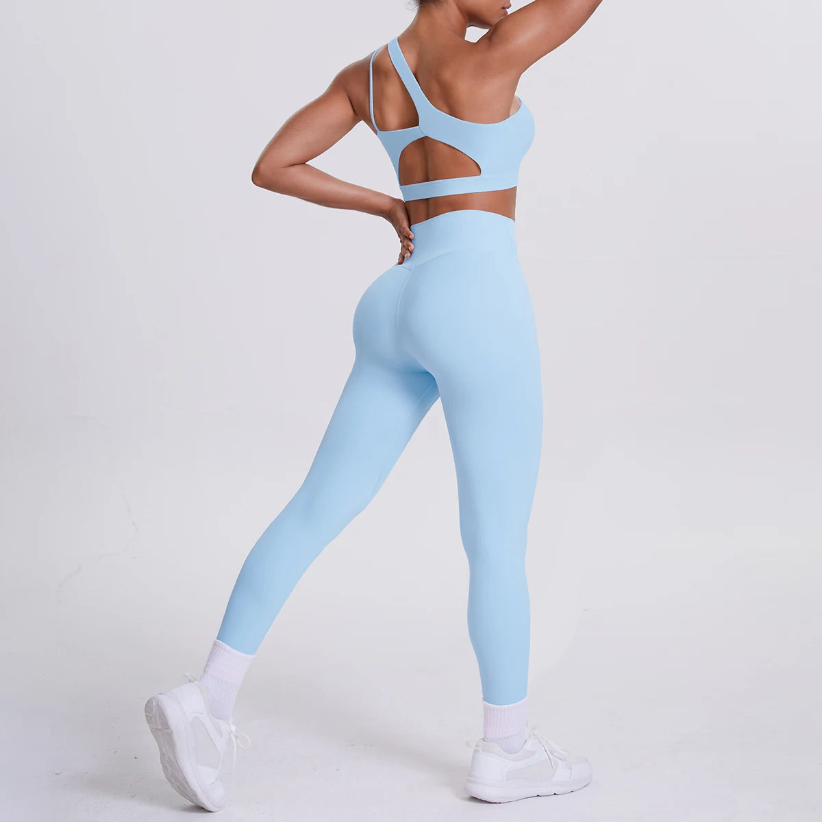 Yoga-Set Damen: hellblaues Sport-Set mit Rücken-Cutout und 3/4-Leggings