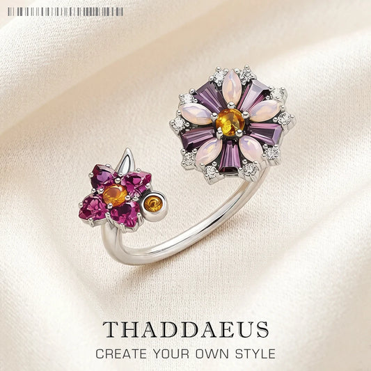 Blumenring aus 925 Sterlingsilber mit violetten und klaren Steinen, goldfarbener Mittelstein
