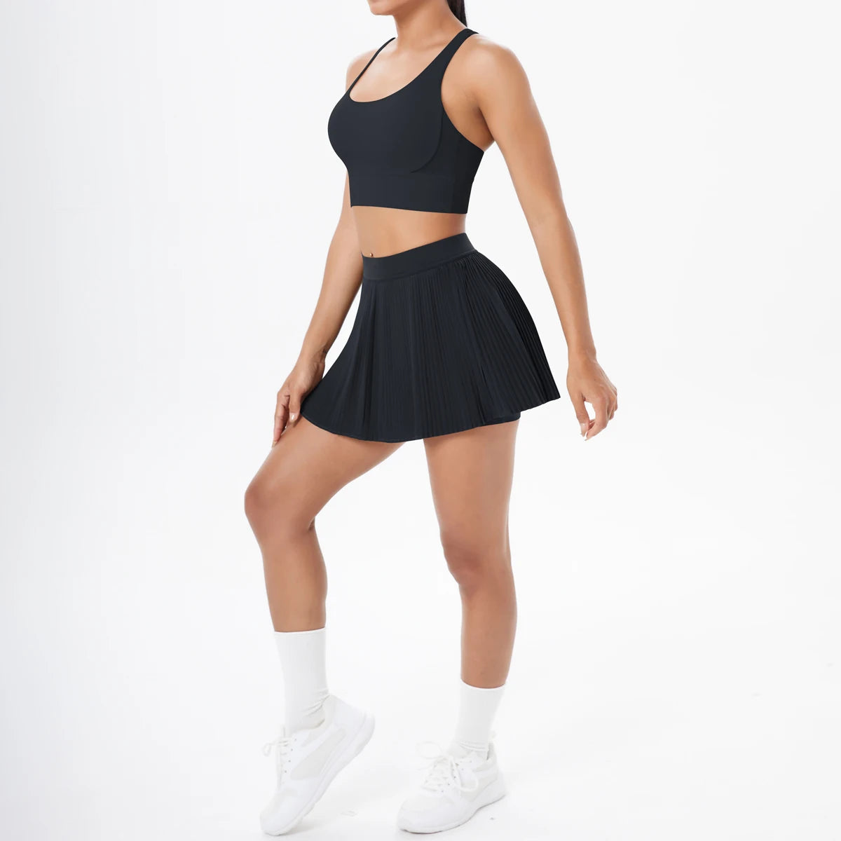 Sportset mit Sport-Bustier und Faltenrock, schwarz, Vorderansicht