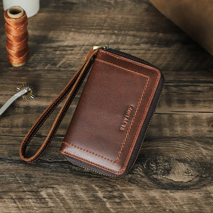 Braune Leder-Schlüsselbrieftasche mit Reißverschluss und Handschlaufe