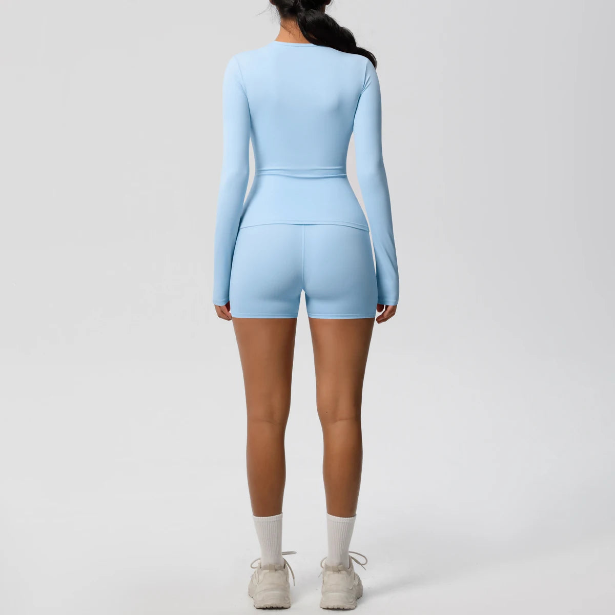 Damen-Yoga-Set Himmelblau, langärmeliges Shirt und kurze Shorts, Rückansicht