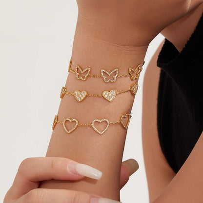 Damen-Charm-Armband mit Herzschleife und Zirkonia