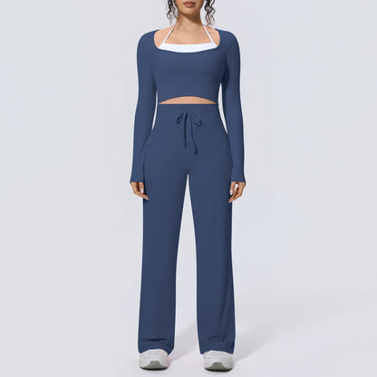 Dunkelblaues Yoga-Set: langärmliges Crop-Top mit weißem Ausschnittband und langer Hose