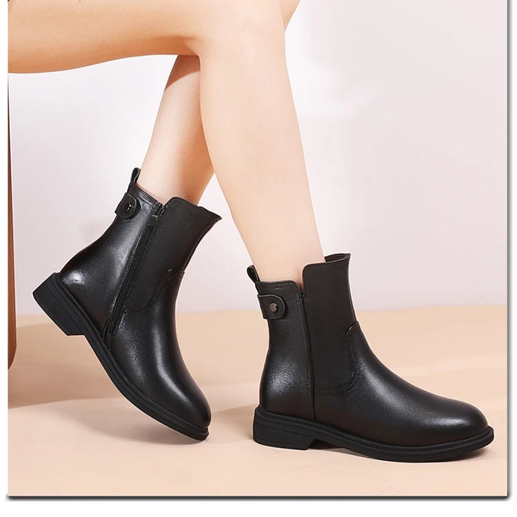 Schwarze kurze Chelsea-Stiefeletten aus Leder, Knopfdetail, rutschhemmende Laufsohle