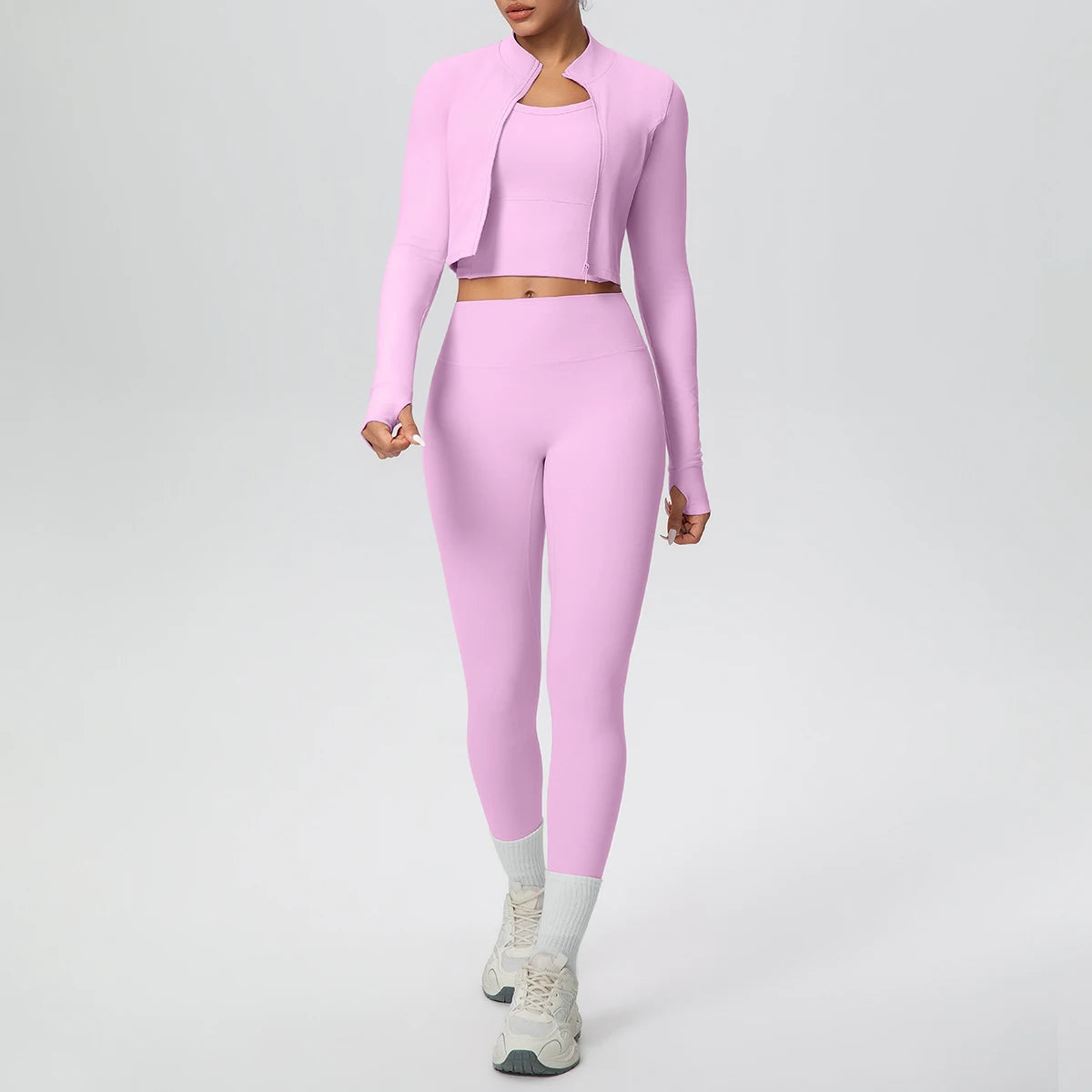 Rosa Yoga-Set: Zip-Top und High-Waist-Leggings, Vorderansicht mit weit ausgestellten Beinen
