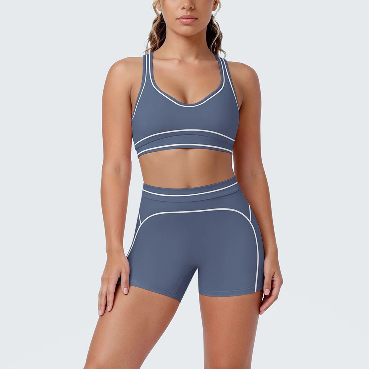Yoga-Set mit Sport-BH und Shorts, dunkelblau, Vorderansicht mit Kontrastlinien