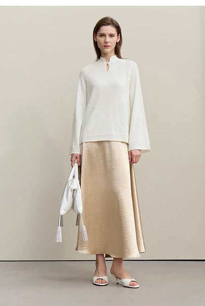 Wollstrickpullover cremefarben mit Stehkragen-Ausschnitt, weite Ärmel, locker fallend