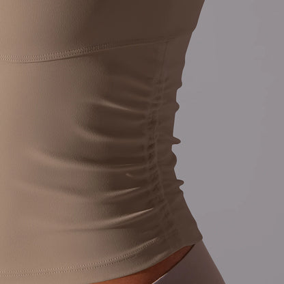 Ärmelloses Yoga-Sporttop Detail: seitliche Naht und geraffter Bereich am Saum