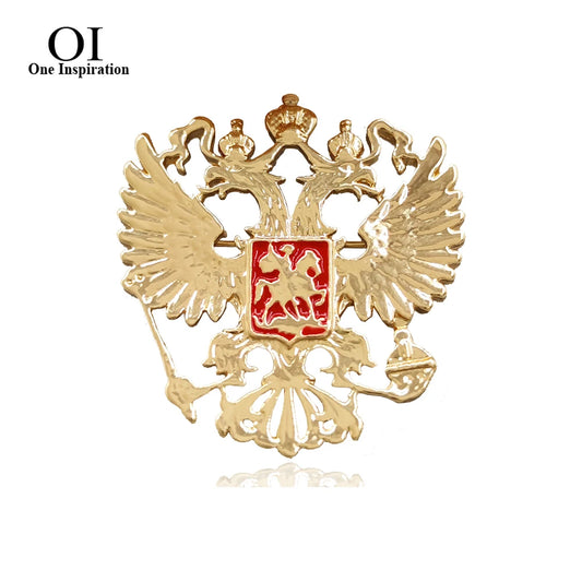 Goldfarbene Adler-Brosche mit rotem Wappen und stilisierten Flügeln, Metall-Corsage