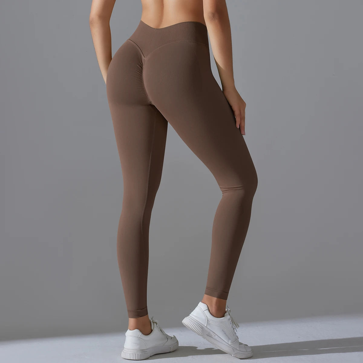 Hamidou nahtlose Yoga-Hose, hoch tailliert, braun, figurbetont bis zum Knöchel.