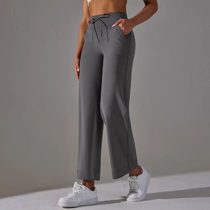 Damen-Leggings mit weitem Bein, hoher Taille und Taschen; dunkelgrau, Kordelzug sichtbar