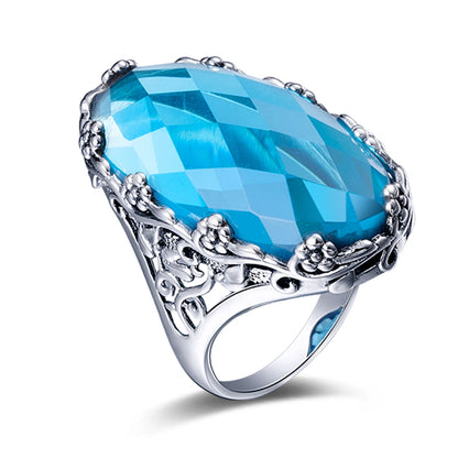 Damen-Ring aus 925er Sterlingsilber mit smaragdgrünem Stein und aufwändigem Blütenmuster