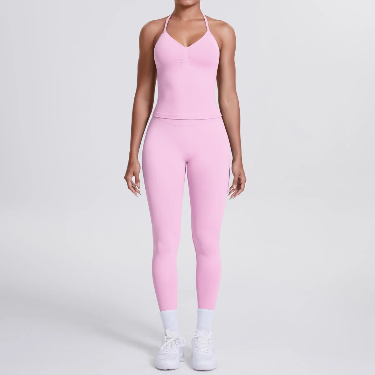Rosa Yoga-Set für Damen: ärmellose Weste mit Trägern und eng anliegende Leggings