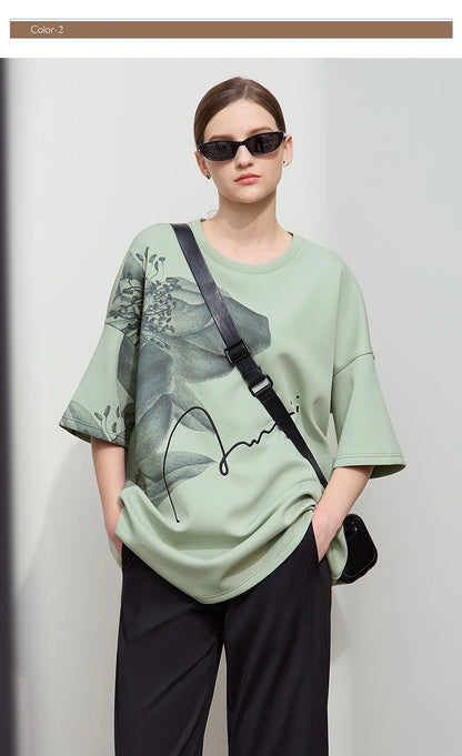 Damen T-Shirt mit lockerem O-Ausschnitt und Blumenmuster sowie Stickerei