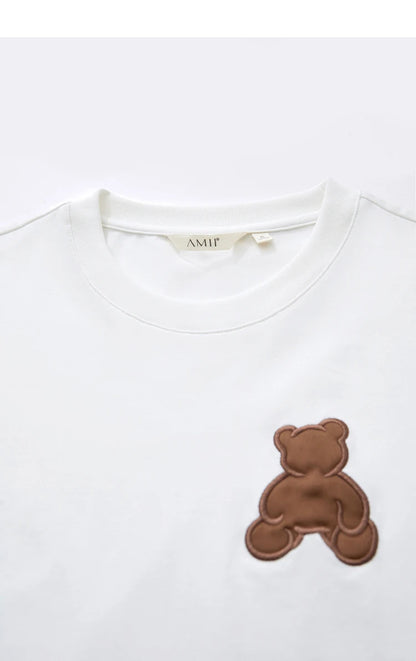 Damen Top im minimalistischen Stil mit Bären-Applikation und O-Ausschnitt